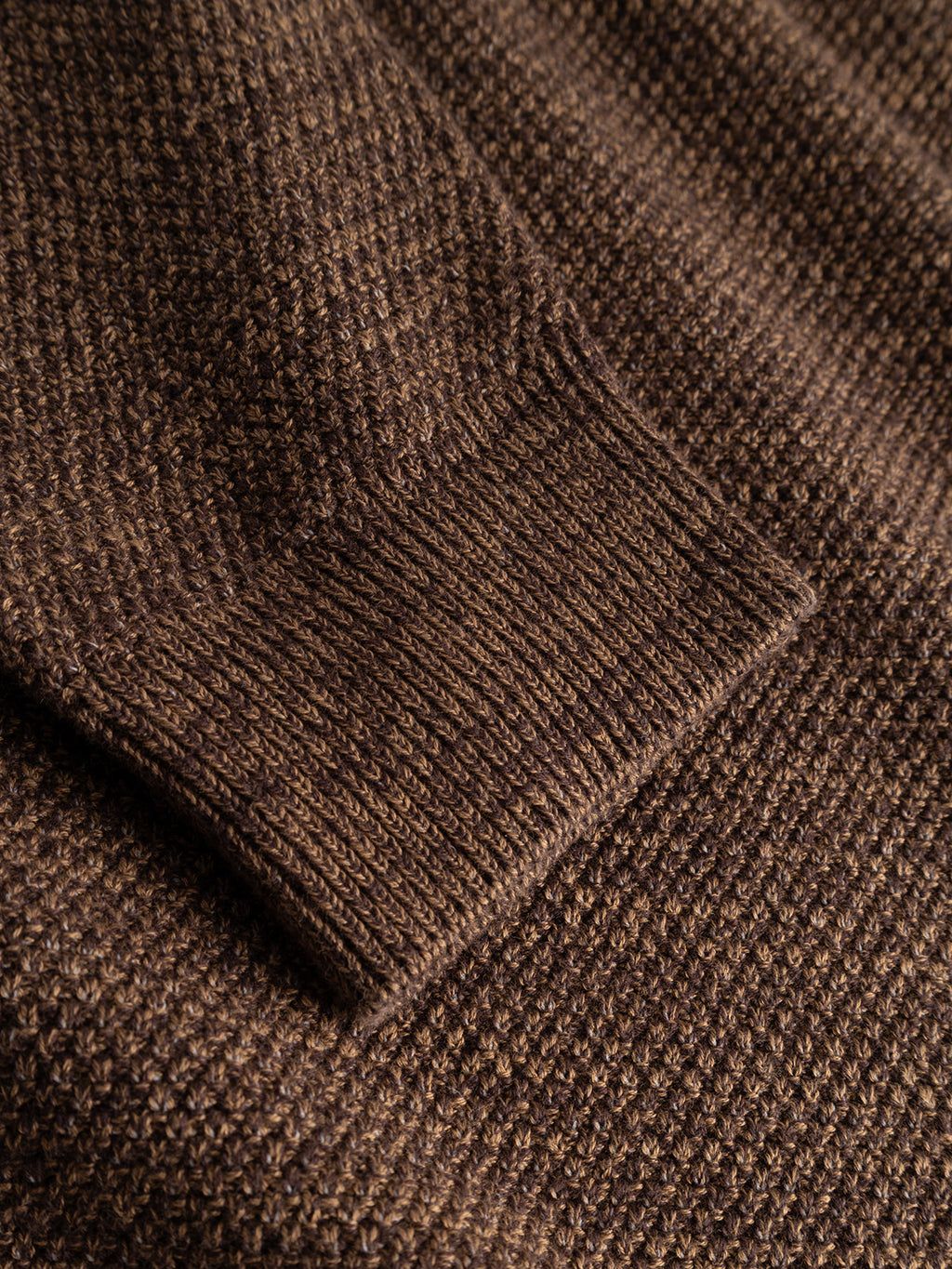 Close-up of the sleeve on the Gabba GABlamix Coro O-Neck LS Knit in Brown Slate, highlighting the textured cotton-blend knit fabric and ribbed cuff.