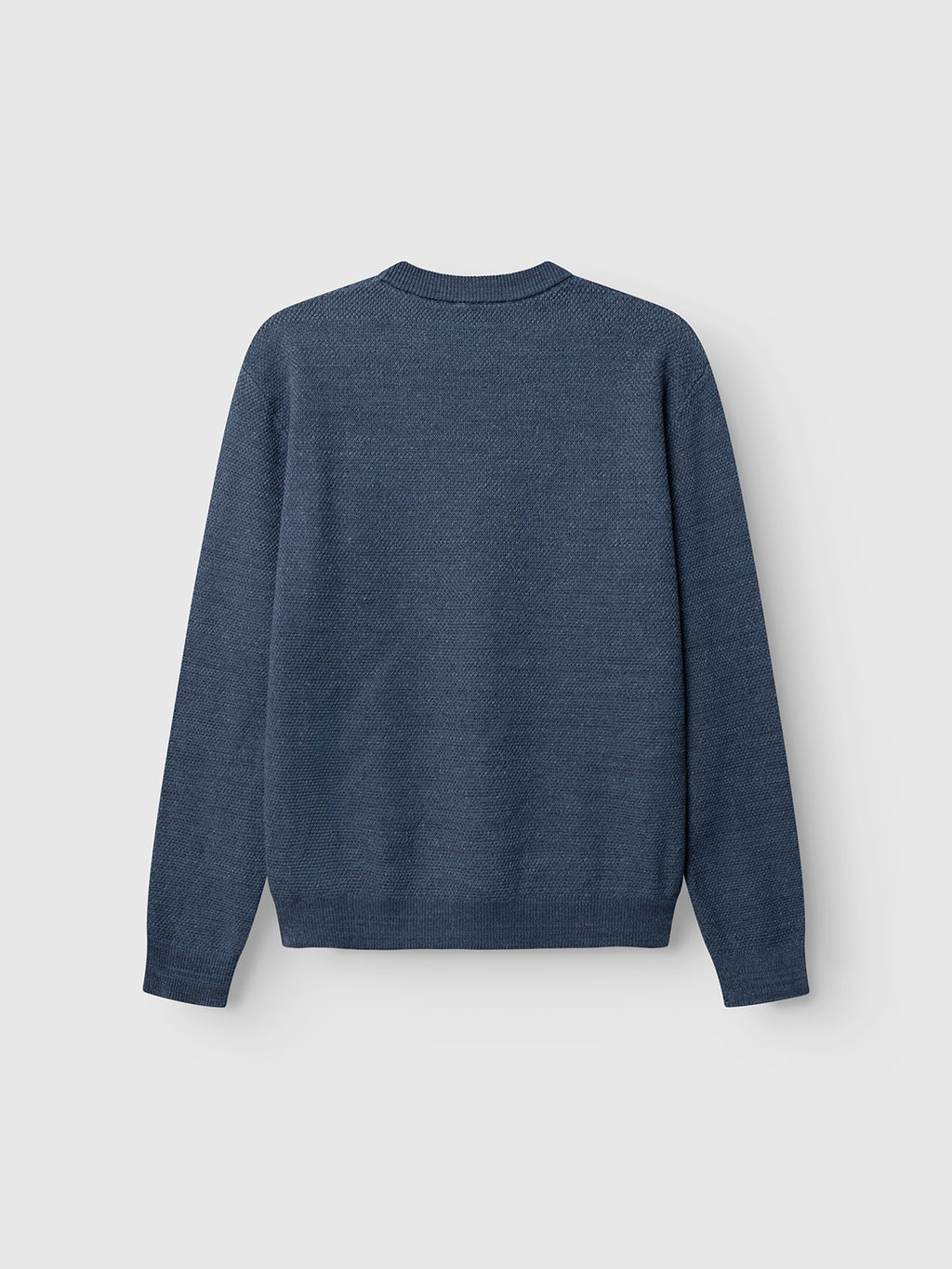 The Gabba GABlamix Coro O-Neck LS Knit in Turbulence Blue is displayed on a plain white background, shown from the back. This cotton-blend sweater features long sleeves, a classic crew neck, and ribbed cuffs and hem.