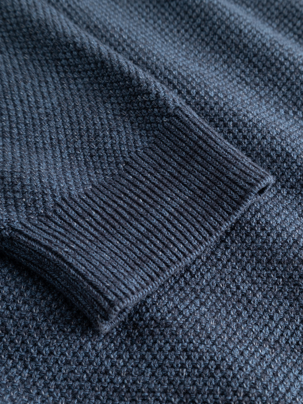 Close-up of the Gabba GABlamix Coro O-Neck LS Knit in Turbulence Blue, showcasing its cotton-blend fabric and ribbed cuff detailing.