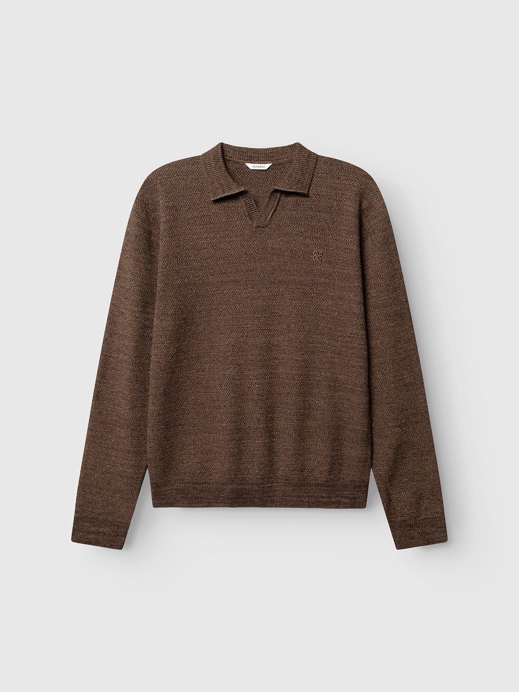 The GABlamix Coro Jhon LS Knit in Brown Slate by Gabba is a long-sleeve, cotton-blend knit sweater featuring a ribbed polo collar and a small v-shaped notch at the neckline. Displayed against a plain light gray background, this stylish piece is subtly distinguished by the signature Gabba Brand Mark.