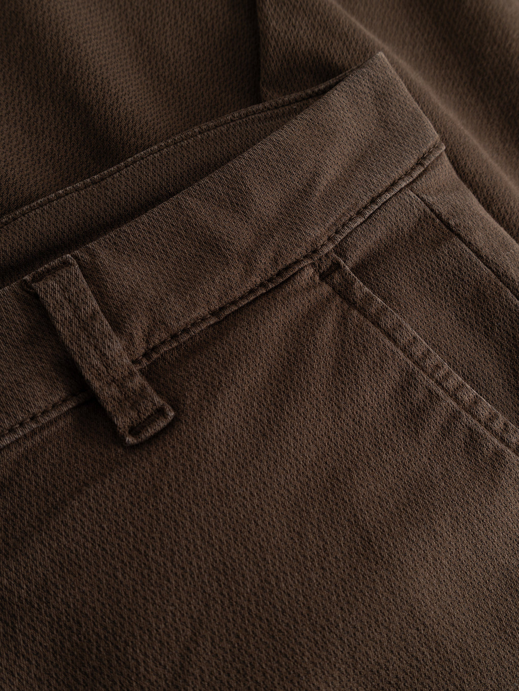 Close-up of the Gabba GABpaul K3280 Dale Chino in Brown Slate, expertly crafted from a high-stretch cotton-blend fabric. The image highlights the waistband, belt loop, and front pocket with visible stitching details—making these slim chinos ideal for everyday wear.