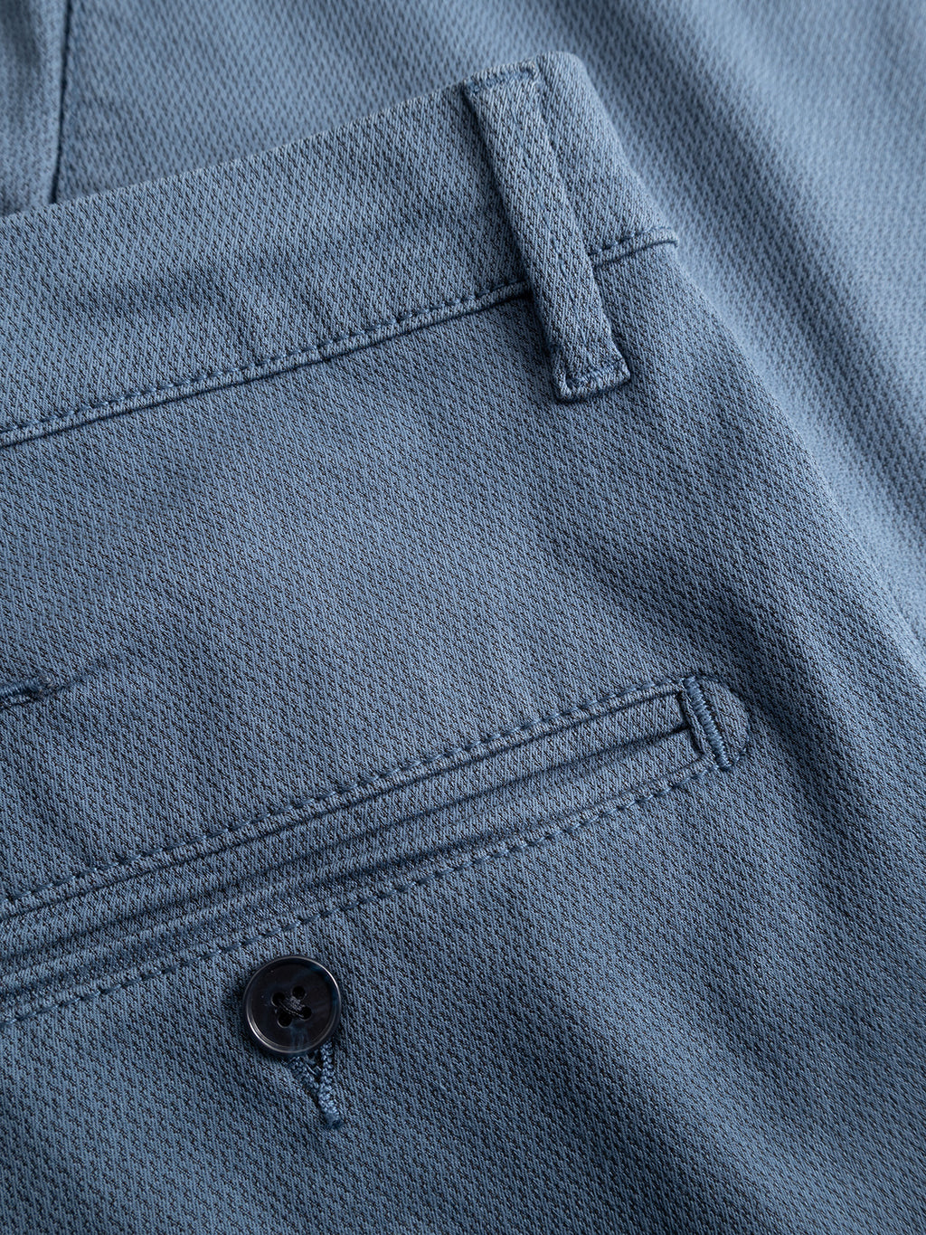 Close-up of the back pocket on the Gabba GABpaul K3280 Dale Chino in Bering Sea, highlighting French pockets, a single black button, and a belt loop above the pocket.