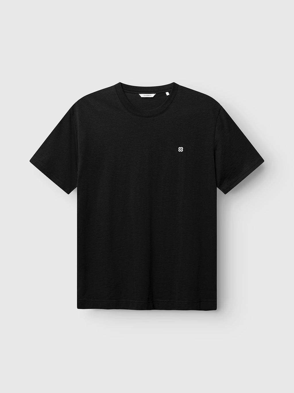 The Gabba GABdune Element GOTS SS T-Shirt in black features a small white embroidered logo on the upper left chest, made from organic cotton and displayed on a light gray background.