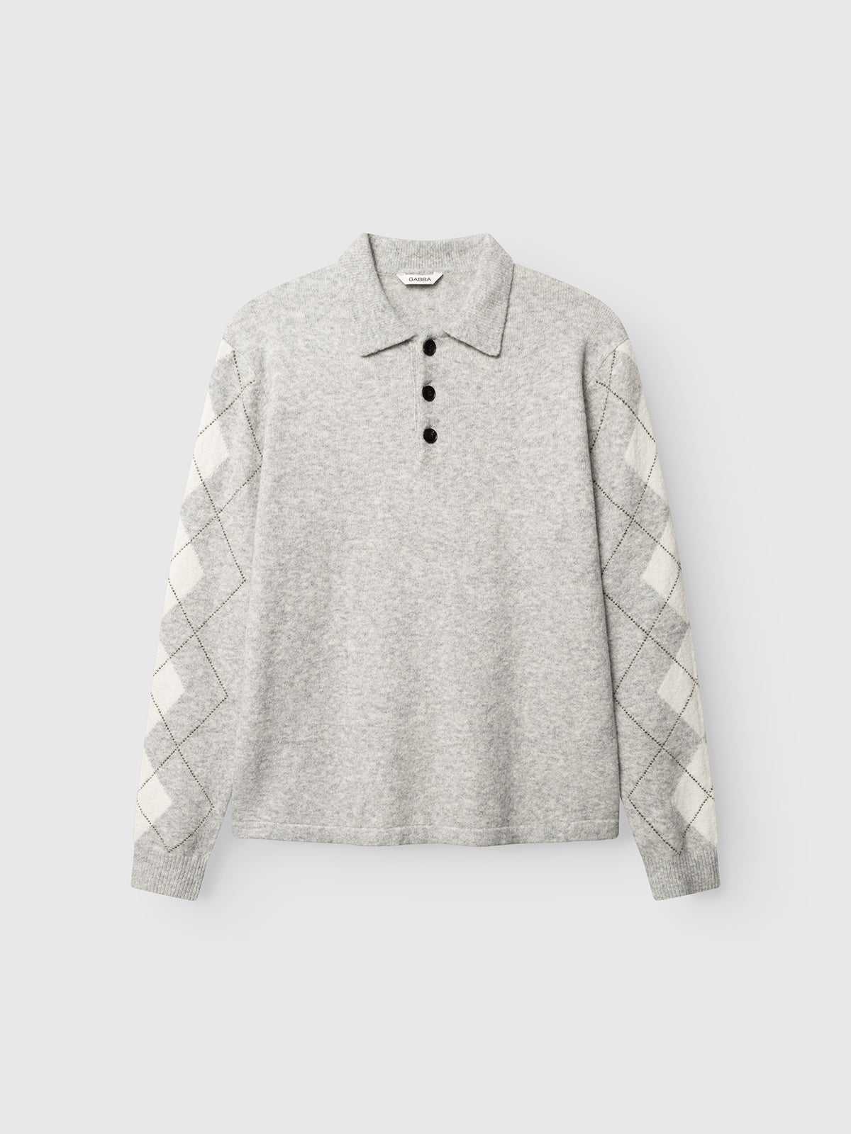 The Gabba GABpietro Polo Argyle LS Knit in Lt. Grey Mel is a light gray long-sleeve cotton blend sweater featuring a modern silhouette, four black buttons, and cream and gray argyle patterned sleeves, shown on a plain white background.