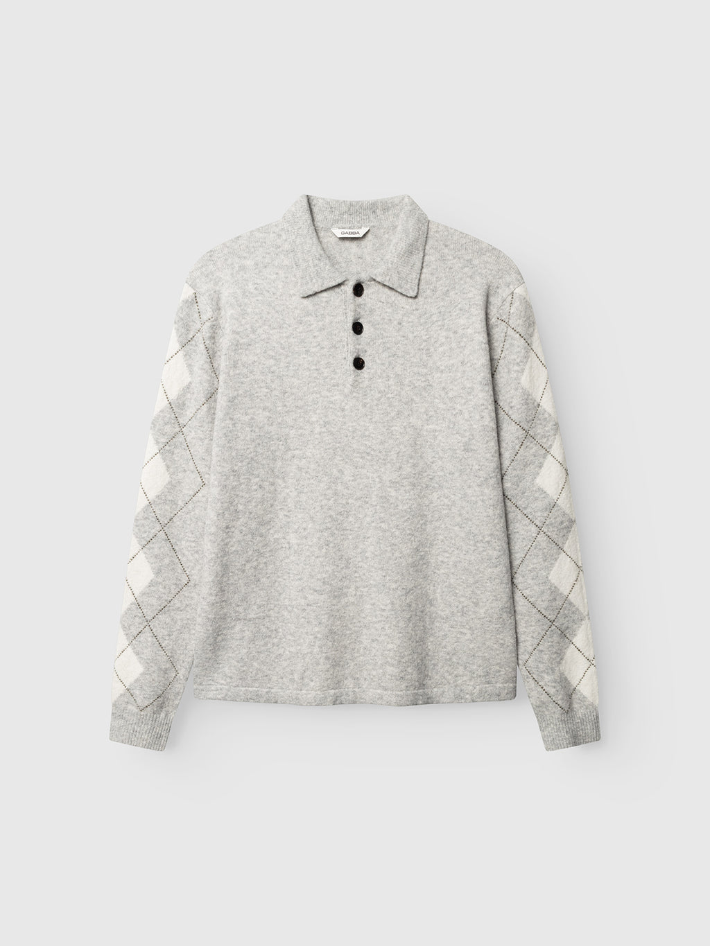 The Gabba GABpietro Polo Argyle LS Knit in Lt. Grey Mel is a light gray long-sleeve cotton blend sweater featuring a modern silhouette, four black buttons, and cream and gray argyle patterned sleeves, shown on a plain white background.