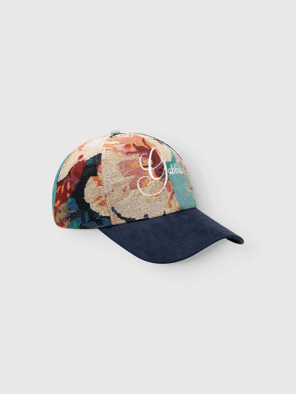 Introducing the GABrichi Fiore Cap - Multi Pattern by Gabba, a jacquard cap showcasing a vibrant, abstract floral design on the crown and complemented by a deep blue suede brim. The adjustable back strap ensures a tailored fit, while “Gabba” is embroidered in white script on the front for an elegant finishing touch.