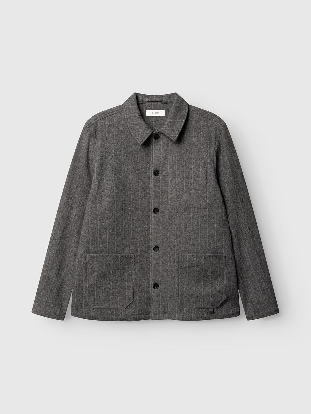 The GABlibre AX Stripes LS Overshirt by Gabba is a dark grey, long-sleeve, button-up overshirt featuring subtle vertical pinstripes and two front pockets, crafted from a soft viscose-blend fabric and displayed against a plain light background.