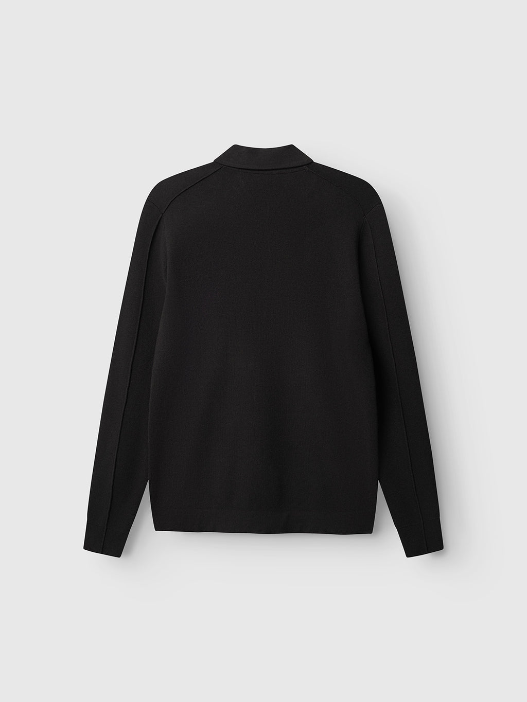 The Gabba GABadriel Half Zip Lume LS Knit in Meteorite is displayed on a plain, light gray background, shown from the back with no visible buttons or patterns. Crafted from a soft viscose blend, this long-sleeve collared sweater offers a versatile regular fit for both comfort and style.