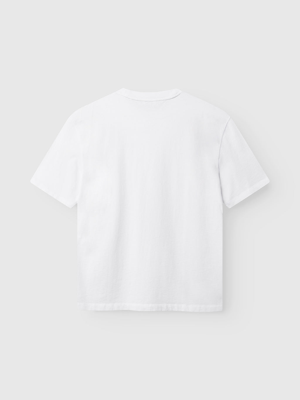 The GABlegin Wix Boxy Hour SS T-shirt – White from Gabba is displayed flat against a light gray background, showcasing the back side of the shirt. Crafted from soft cotton jersey with a relaxed boxy fit, this short-sleeve tee combines effortless style and comfort.