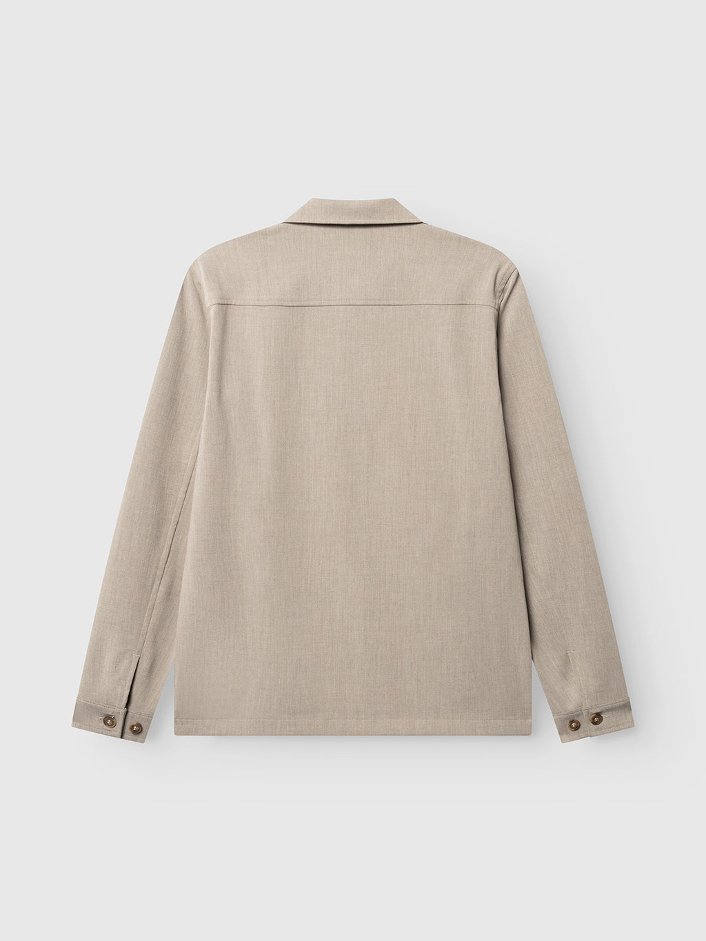 The Gabba GABtogger Push Phin LS Overshirt GRS in Sand is displayed from the back, highlighting its straight hem, cuff buttons, and simple collar. Crafted from a comfortable wool-viscose blend in a regular fit, this essential layering piece is perfect for any wardrobe. Shown on a plain white background.