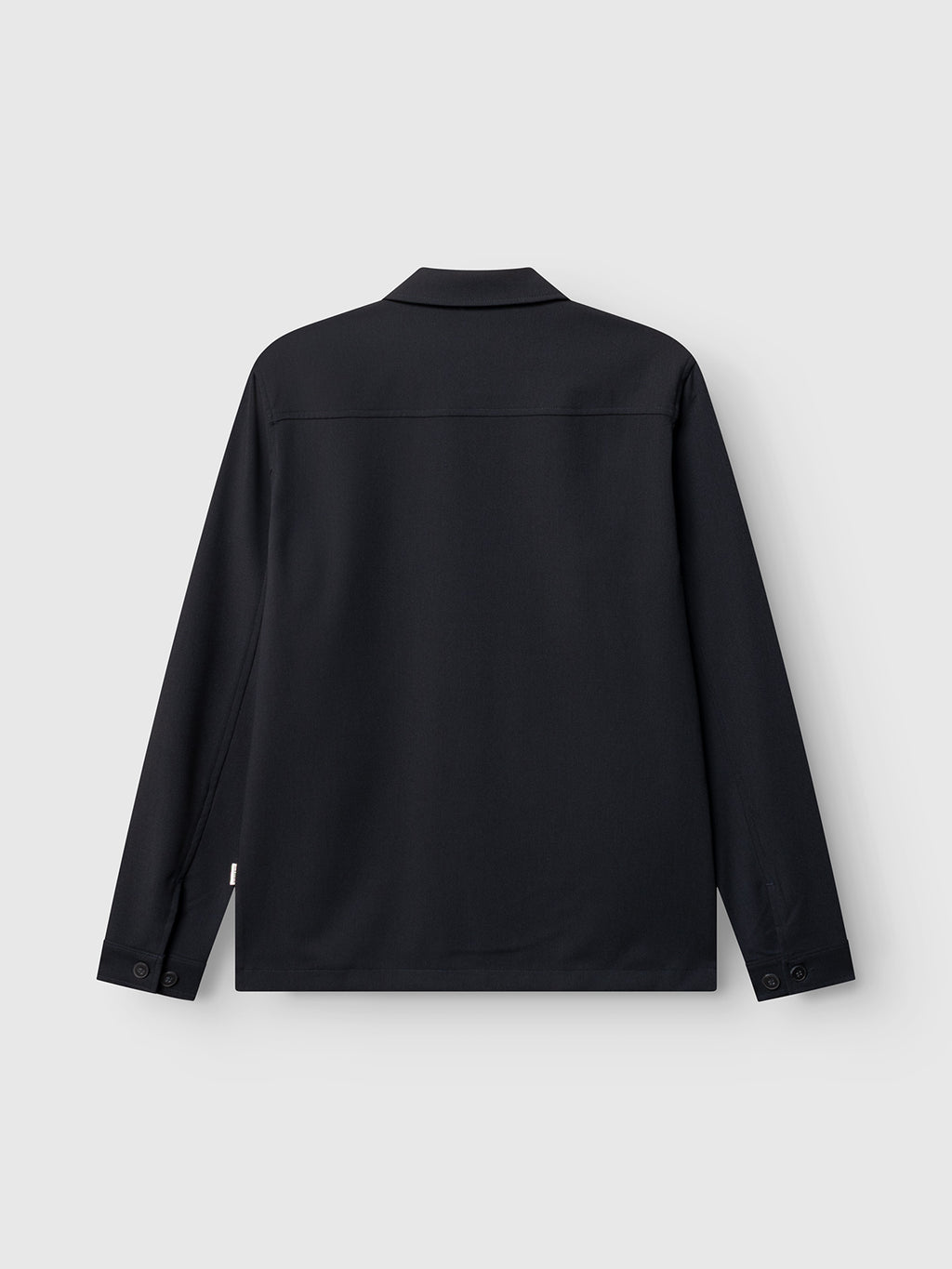 The Gabba GABtogger Push Phin LS Overshirt GRS in Blue Black is shown from the back against a light gray background, featuring a collared neckline and buttoned cuffs. Designed in a regular fit from a soft wool-viscose blend, this versatile layering essential combines classic style with comfort for everyday wear.