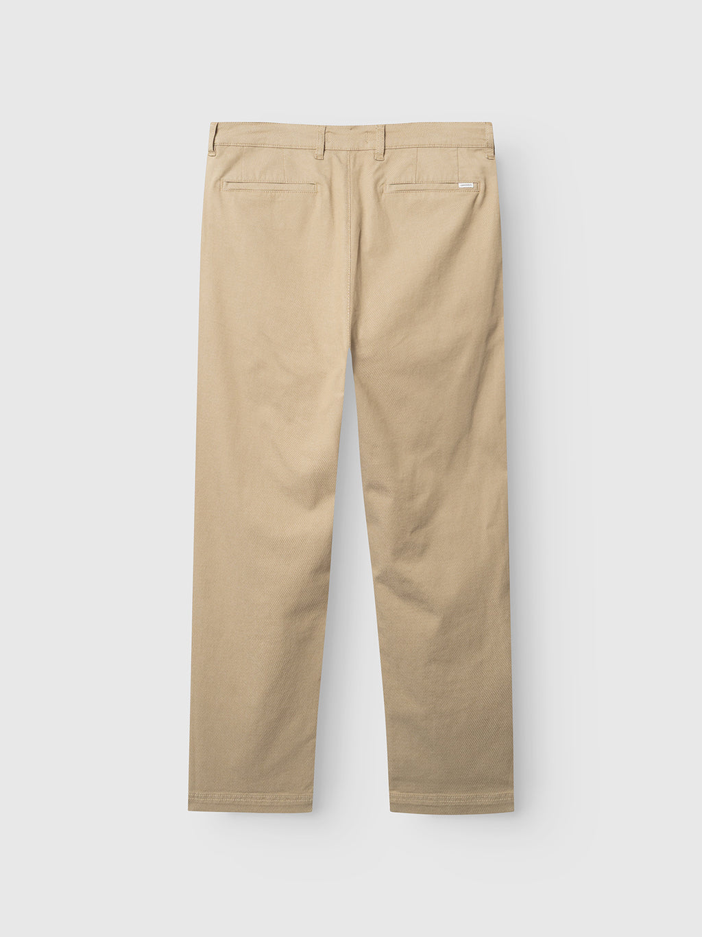 The Gabba GABjoe-pas Dale Pant in Sand is displayed from the back, showcasing two welt pockets and a straight-leg fit, crafted from a high-stretch cotton-blend fabric and laid flat on a white background.
