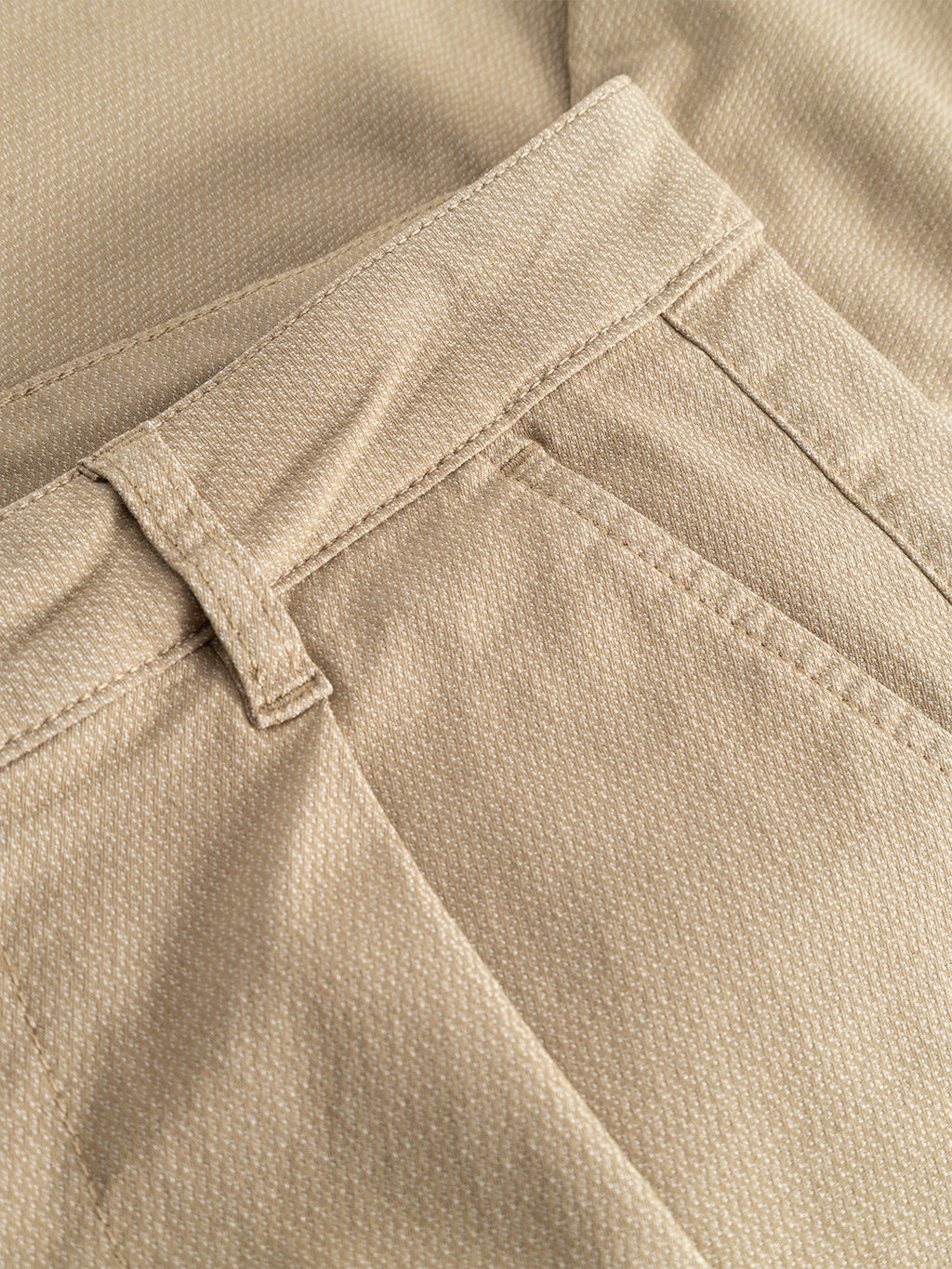 Close-up of the Gabba GABjoe-pas Dale Pant in Sand, highlighting the waistband, belt loop, and front pocket with a subtle textured fabric crafted from a high-stretch cotton blend.