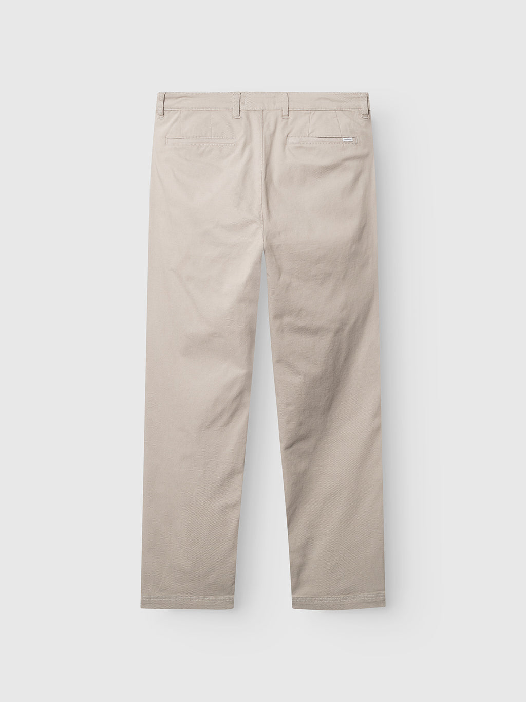 Grey Paloma GABjoe-pas Dale Pant by Gabba laid flat, back view, featuring straight legs, belt loops, two back welt pockets, and a subtle stitched brand tag above the right pocket on a plain white background. Crafted from high-stretch cotton-blend fabric for all-day comfort, these tailored trousers combine style with flexibility.