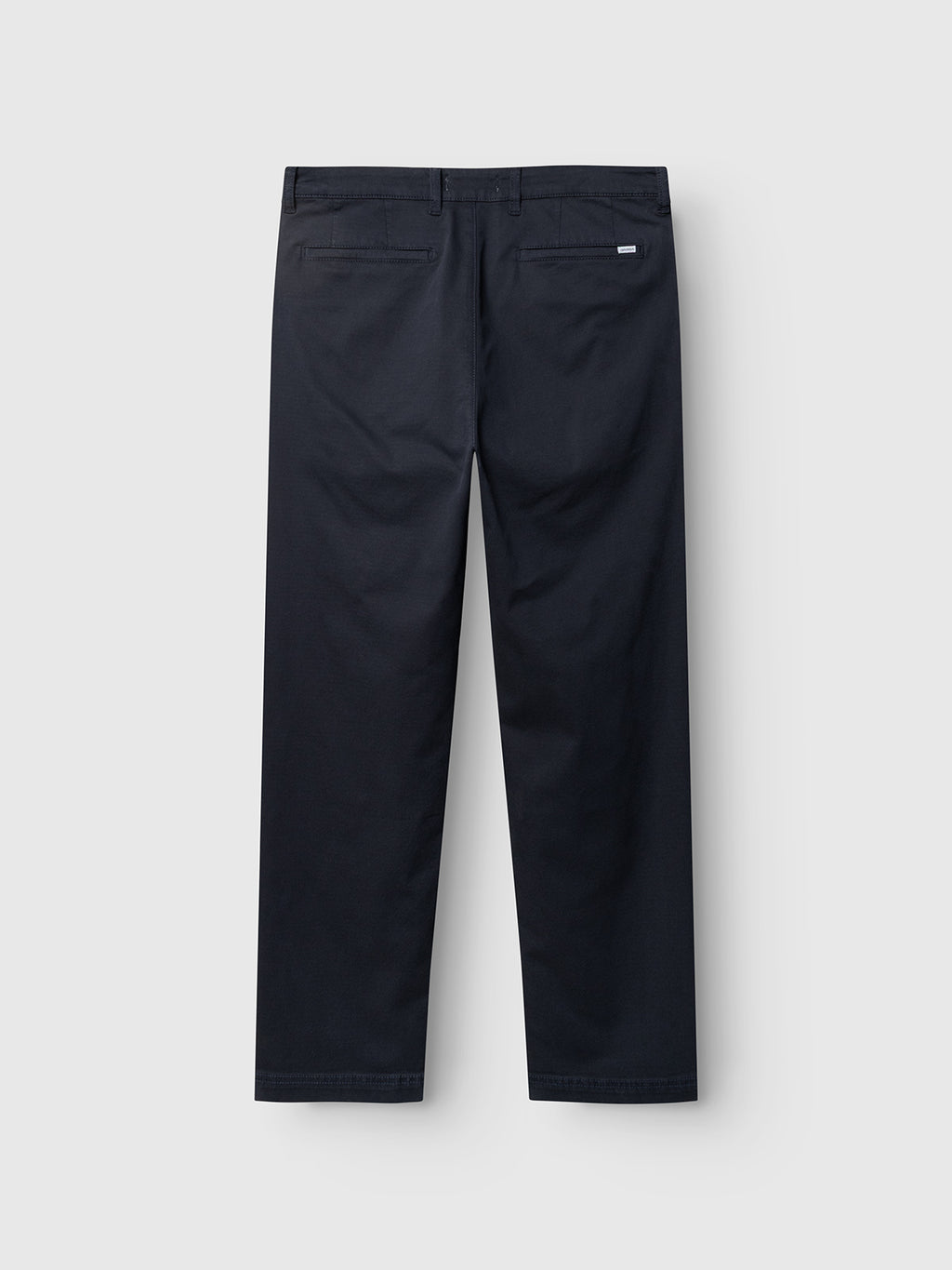 A pair of Gabba GABjoe-pas Dale Pants in blue black, shown from the back, featuring two welt pockets and a small white tag on the right pocket. Crafted from a high-stretch cotton blend, these tapered fit pants offer a contemporary silhouette for a modern, polished look.