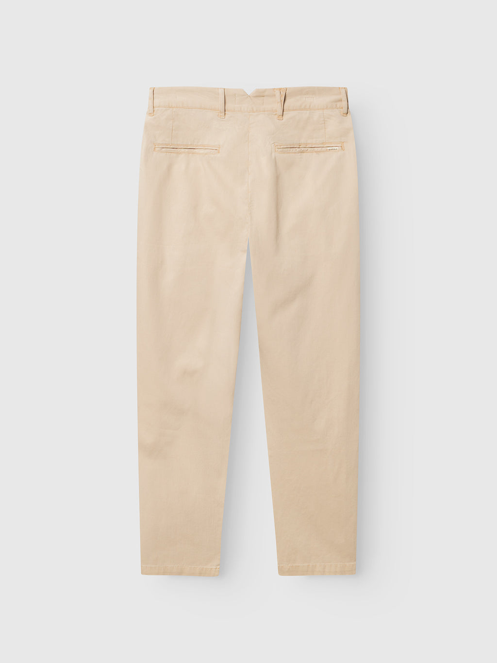 The Gabba GABfirenze Cropped Marlo Pant in Birch is showcased from the back, highlighting two welt pockets, belt loops, and a straight-leg silhouette. Made from garment-dyed dobby fabric, these relaxed fit trousers deliver a comfortable yet refined appearance against a plain white background.