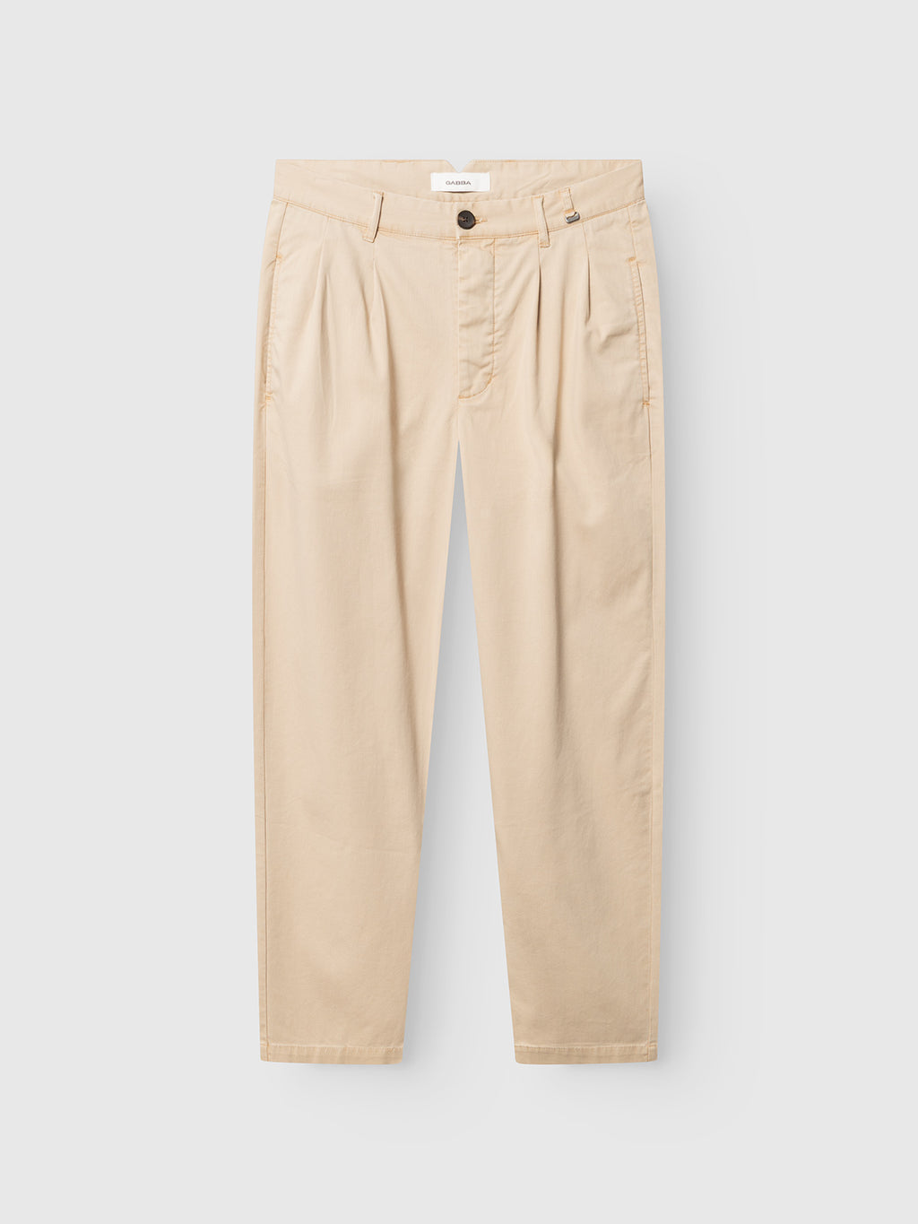The GABfirenze Cropped Marlo Pant by Gabba in Birch showcases a relaxed fit crafted from garment-dyed dobby fabric, detailed with pleats, belt loops, a front button and zip closure, and a contemporary cropped length. Pictured flat against a white background.