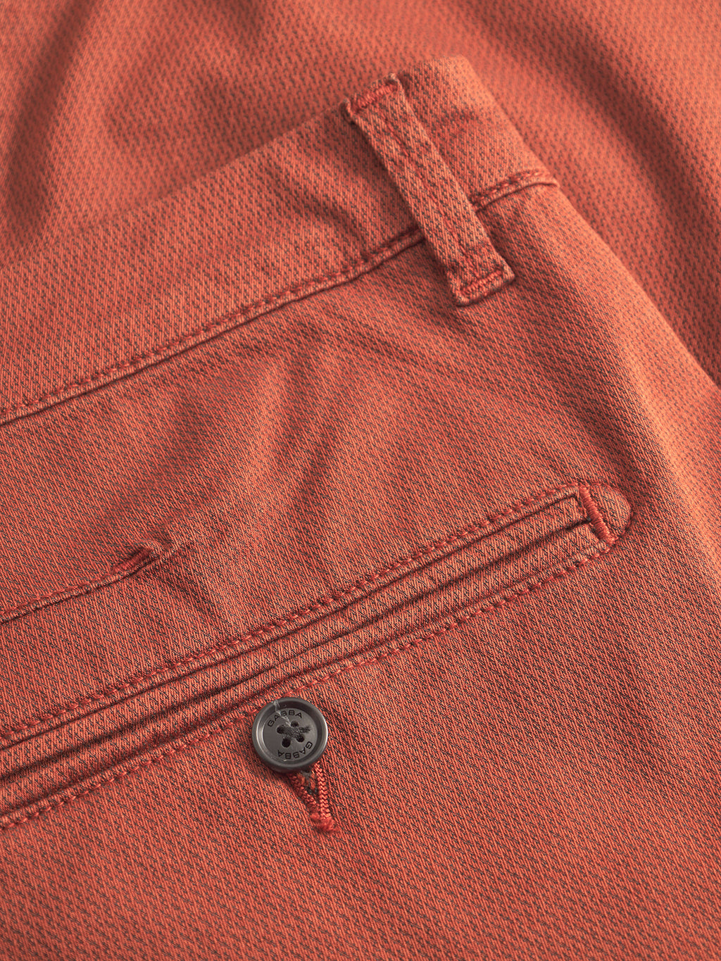 Close-up of the brown rust textured fabric from Gabba’s Paul K3280 Dale Chino, showing a back pocket with button and part of a belt loop.