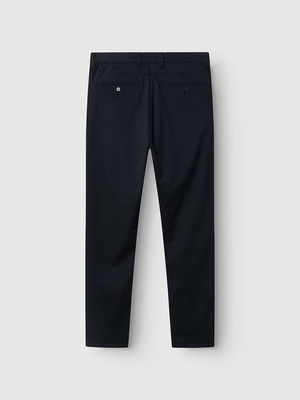 The Gabba GABpaul K3280 Dale Chino in Blue Black is shown from the back, featuring double paspel back pockets—one with a button closure, one with a metal rivet—against a plain light gray background.