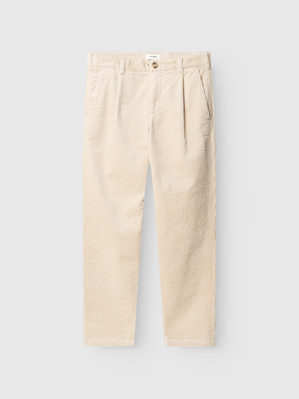 The GABnapoli 19 Ibre Pant - Birch by Gabba features beige cotton corduroy in a straight-leg cut with front pleats, side pockets, belt loops, and a button closure. Laid flat on a light background, these classic men’s tailored pants combine comfort with timeless style.