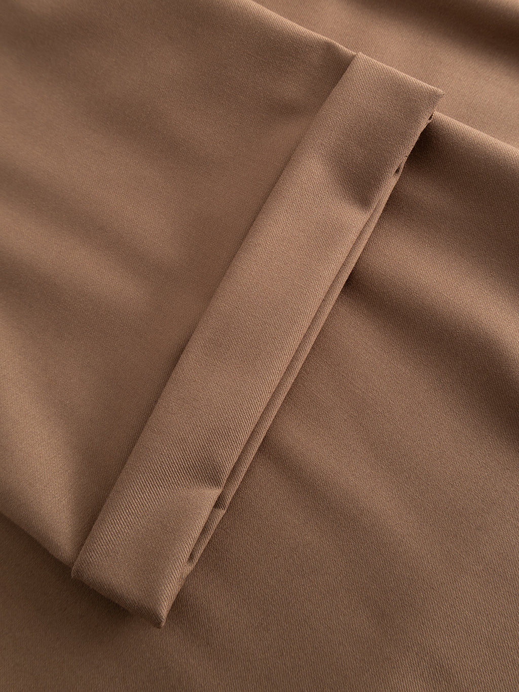 Close-up of Gabba's GABjoe Turnup Fin Pant in Sand, featuring smooth light brown twill viscose blend fabric with a visible seam—ideal for classic or tapered-fit chinos.