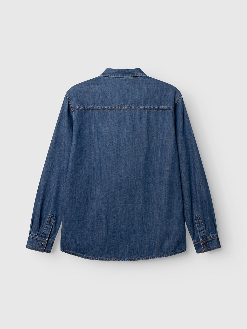 The Gabba GABsven Reg Wish LS Shirt in Mid Blue Denim is a regular fit, long-sleeved cotton denim shirt displayed flat from the back, featuring buttoned cuffs and a straight hem against a light gray background—a versatile wardrobe essential that complements any style.