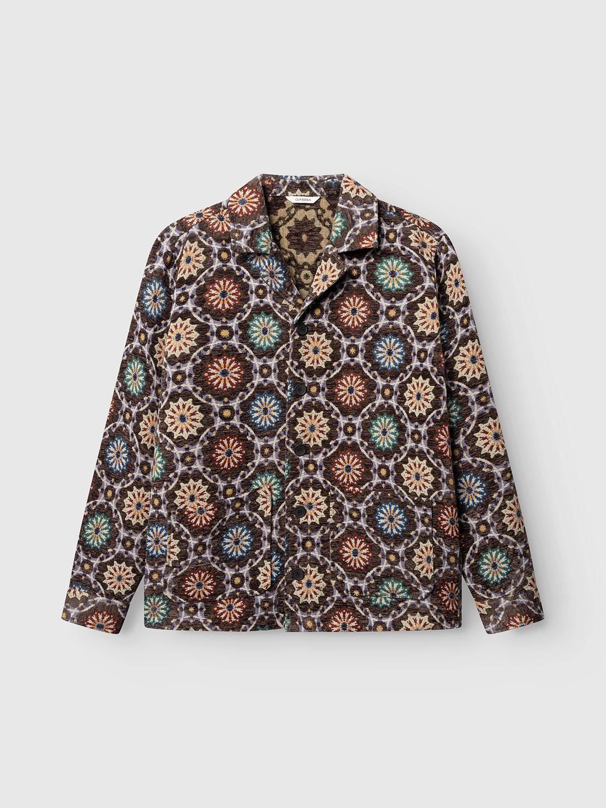 The Gabba GABsimone Nava LS - Brown jacket is a long-sleeve piece crafted from textured jacquard fabric, featuring a vibrant geometric mandala pattern in shades of brown, blue, orange, green, and beige. It is showcased against a plain light background.