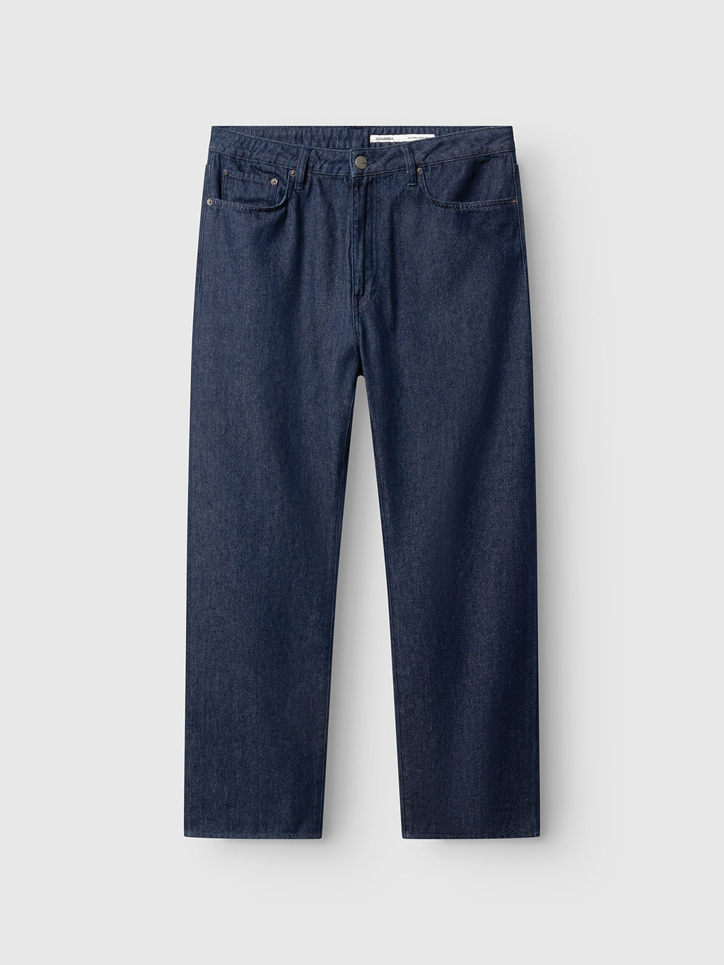 GABnoah Tona Rinse Jeans by Gabba in dark blue denim, crafted from rigid 3x1 indigo organic cotton for comfort and lasting style. These loose straight-leg jeans feature a button and zip front closure, five pockets, and belt loops. Displayed flat on a light gray background.