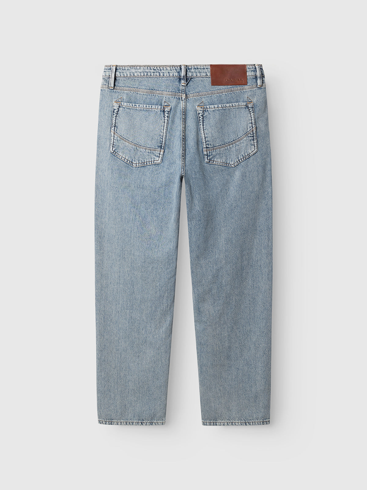 Back view of the Gabba GABmax Tona RS2100 Jeans in mid blue denim, featuring two rear pockets, belt loops, straight legs, and a brown leather patch on the waistband. The jeans are laid flat against a plain white background.