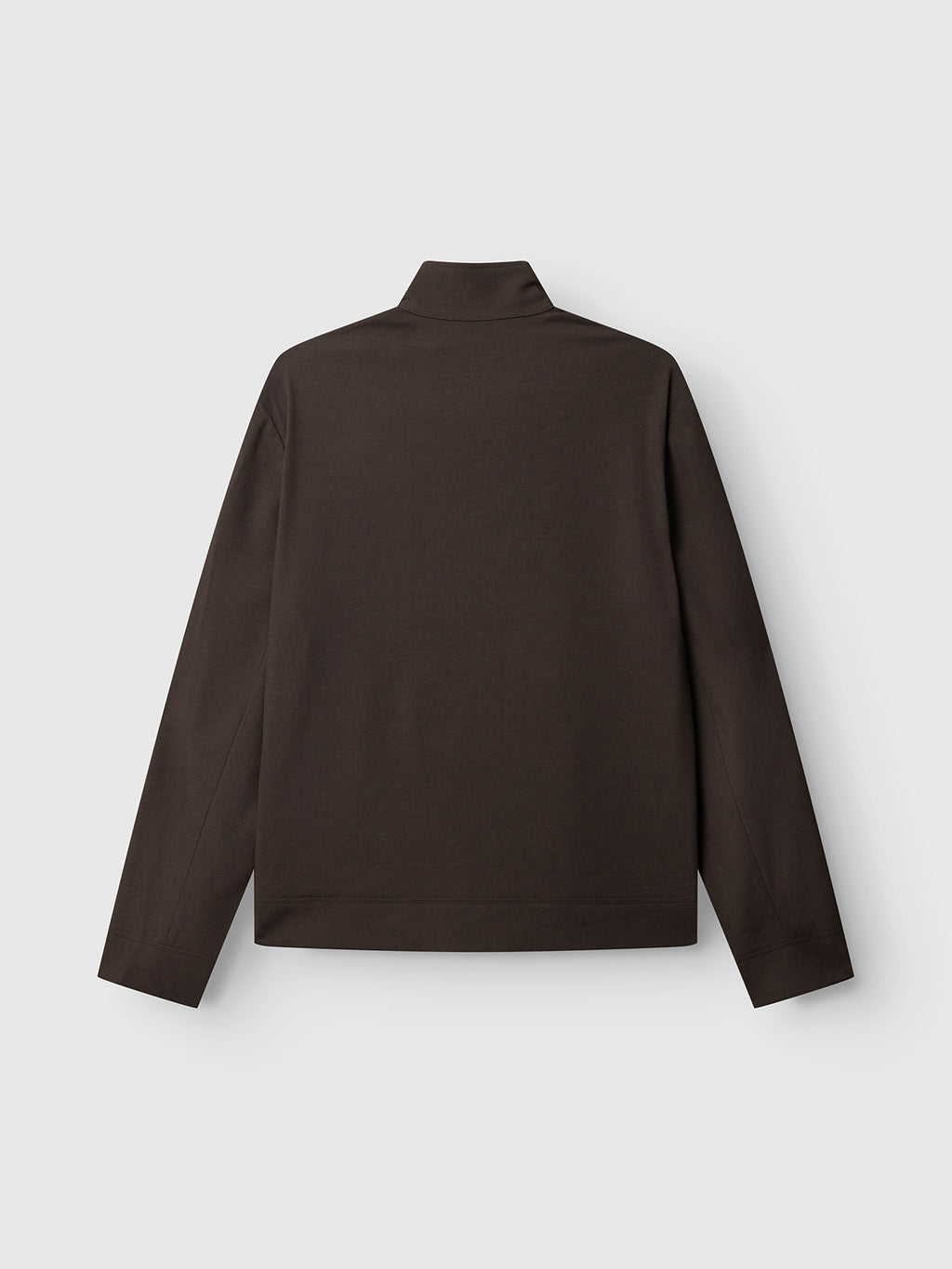 Gabba’s GABnik Phin GRS - Brown Slate is a dark brown, long-sleeve shirt with a high collar, displayed flat against a light gray background and shown from the back—this versatile layering piece effortlessly blends modern outerwear elements with classic style.