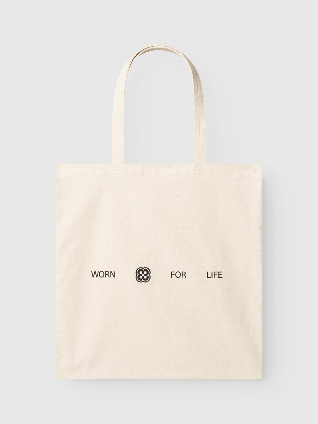 Off-white GABworn Tote Bag - Off White featuring Gabba branding with the text WORN and FOR LIFE separated by a four-leaf clover icon.