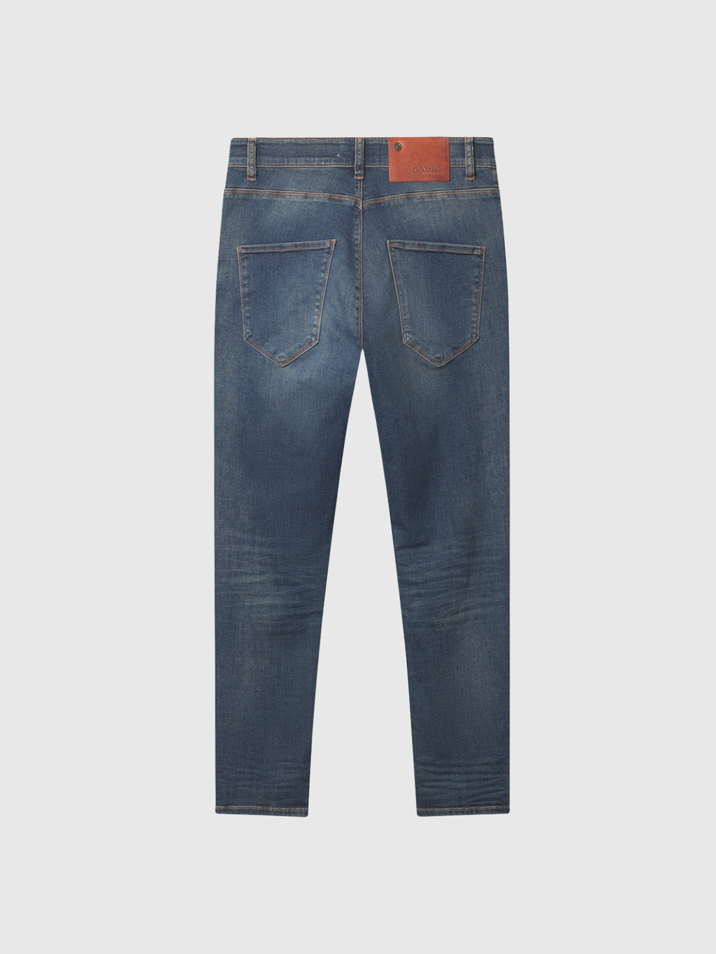 Back view of GABBA GABrey K3606 Mid Blue Jeans in mid blue denim, featuring two rear pockets, a brown leather patch on the waistband, and subtle leg fading, displayed on a plain light background for a relaxed look.